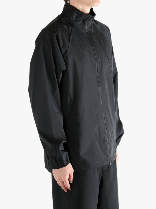 Black jacket worn by a person, showing the jacket's fit