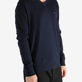 Navy sweater worn by a person, showing the sweater's fit