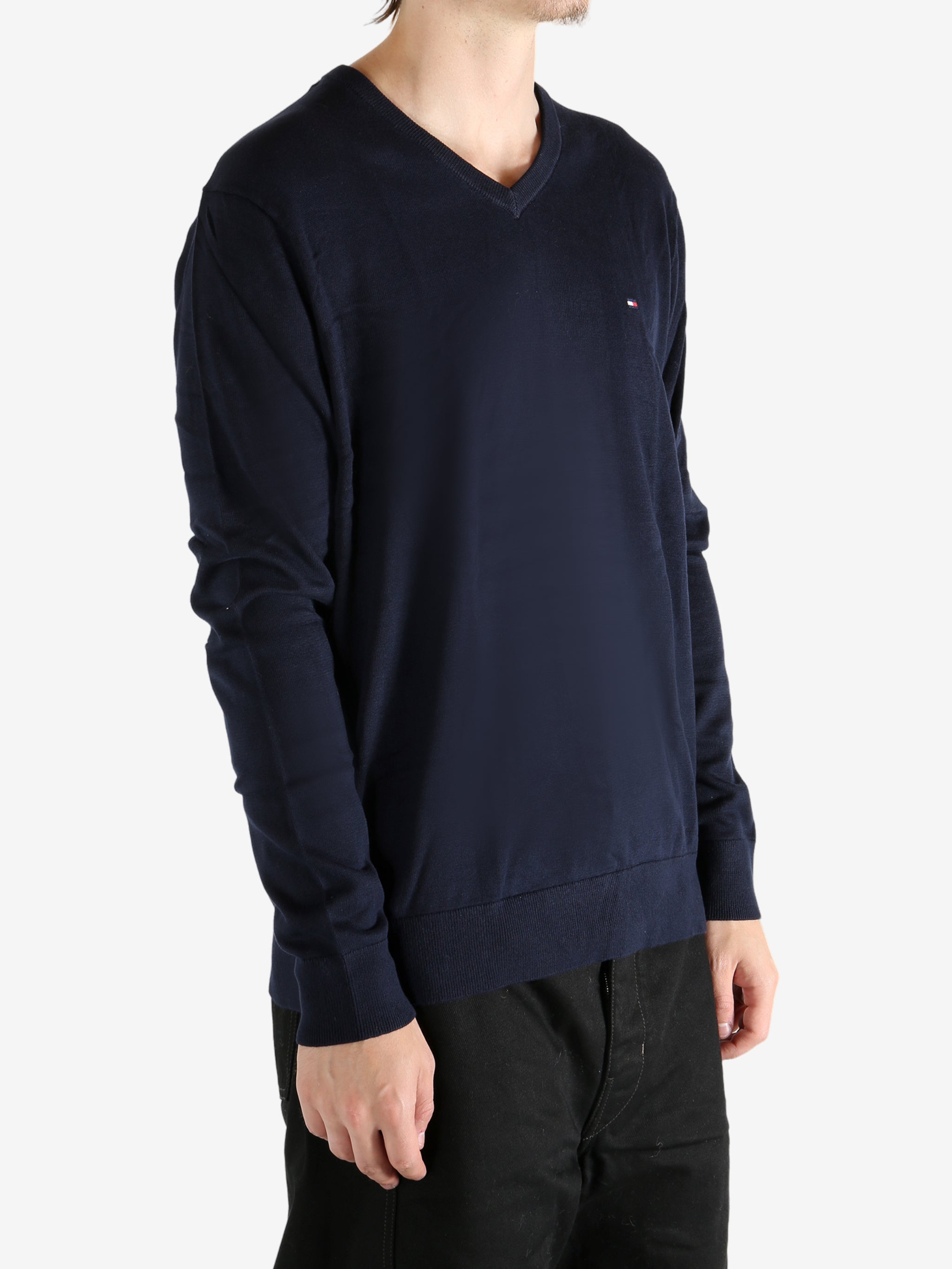 Navy sweater worn by a person, showing the sweater's fit