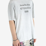 Grey t-shirt worn by a person, showing the shirt's fit