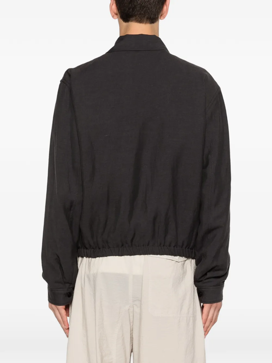 Black jacket worn by a person, showing the jacket's fit