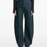 Navy pants worn by a person, showing the pants' fit