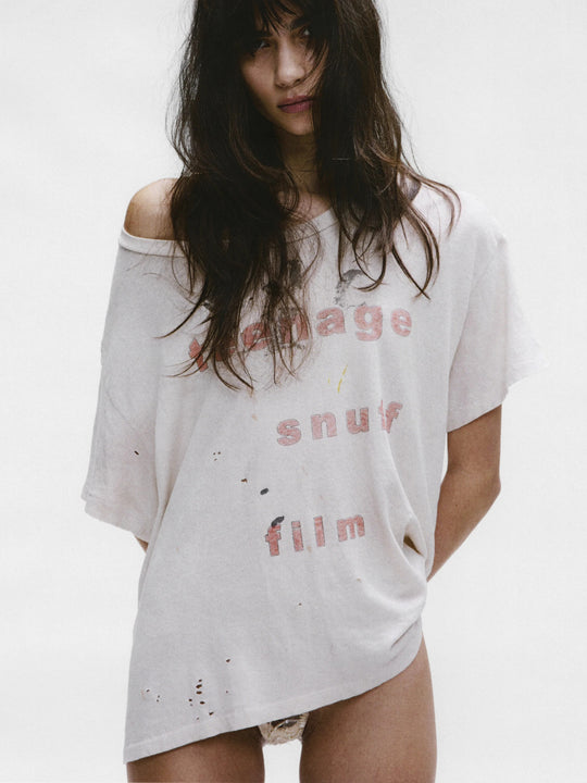 White t-shirt worn by a person, showing the shirt's fit