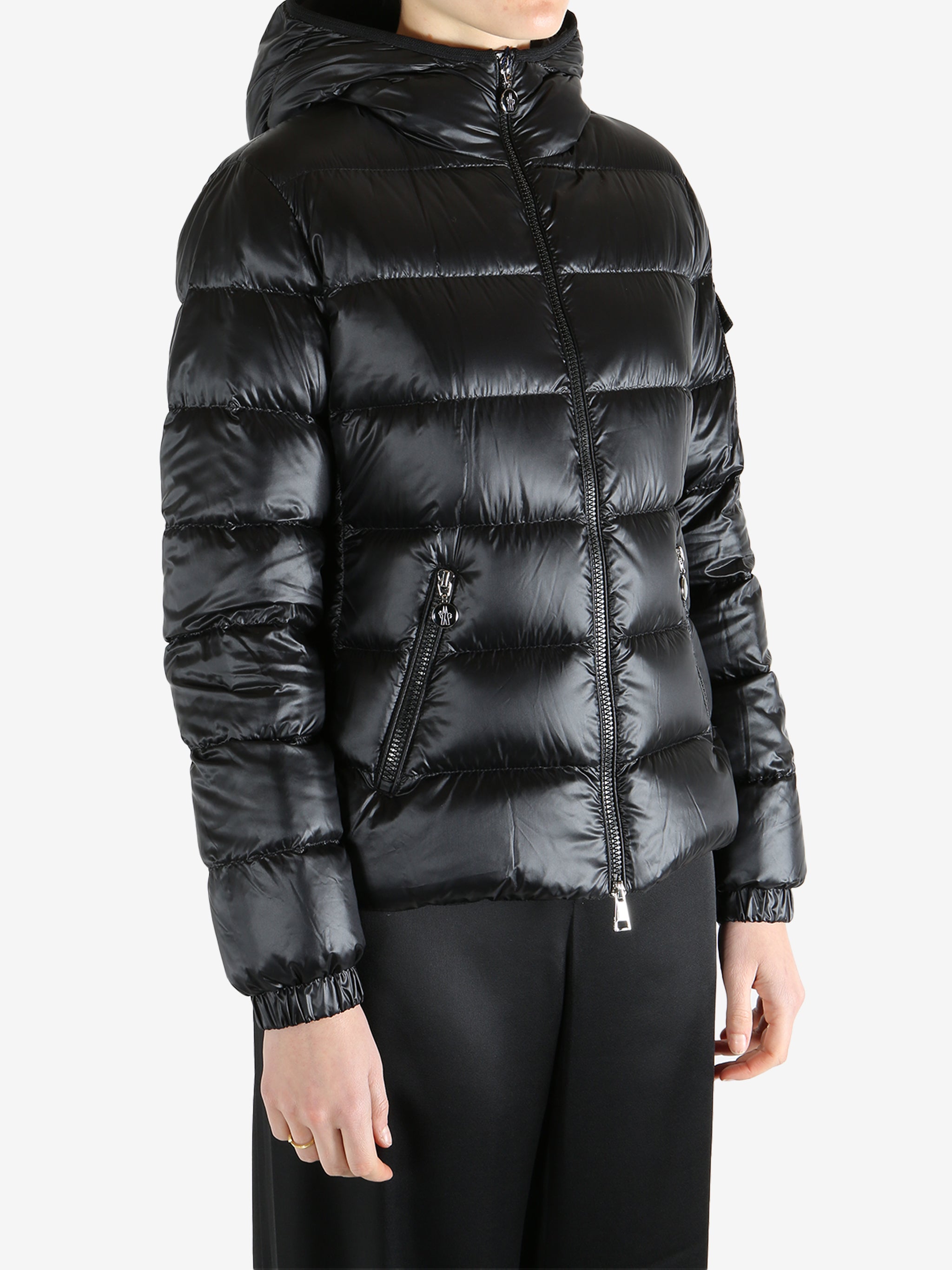 Black jackets-coats worn by a person, showing the jackets-coats fit