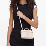 Tan bags worn by a person, showing the bags fit