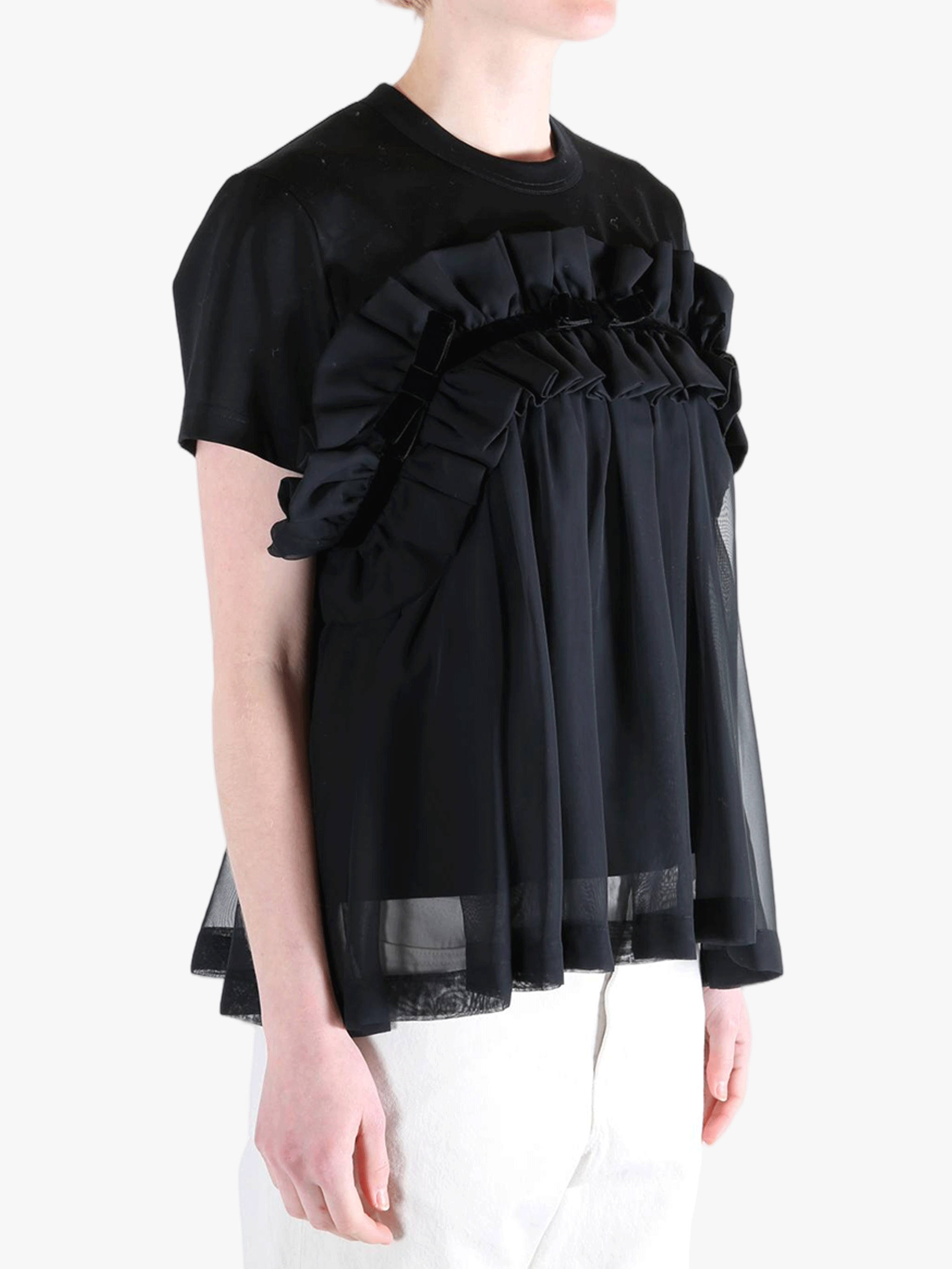 Black t-shirts worn by a person, showing the t-shirts fit