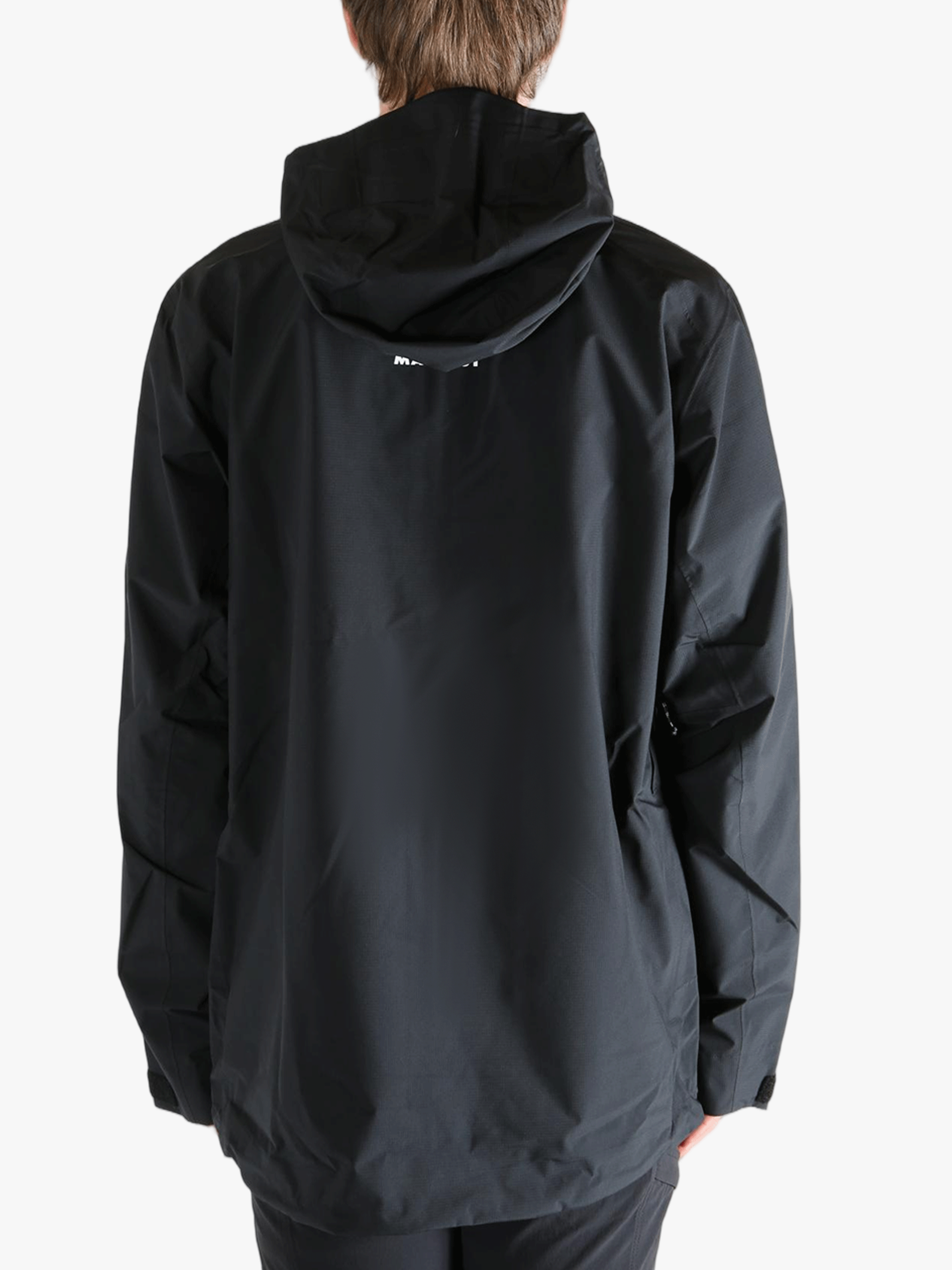 Black jacket worn by a person, showing the jacket fit