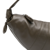Close up of green bag, showing texture of the Calf Leather fabric