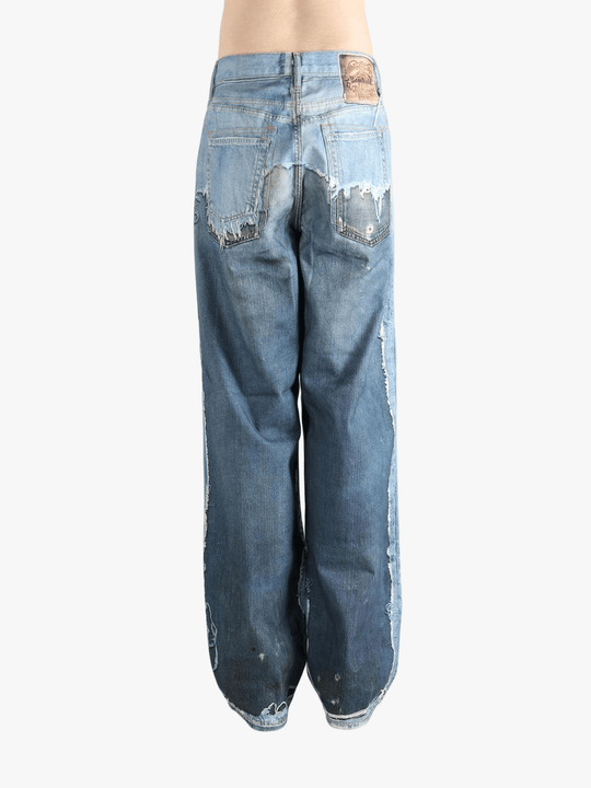 Blue jeans worn by a person, showing the jeans fit