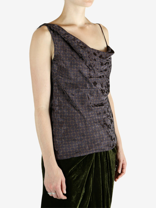 Brown top worn by a person, showing the top's fit