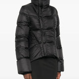 Black jacket worn by a person, showing the jacket fit