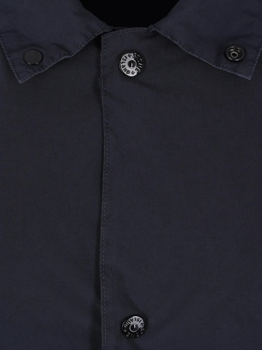 Close up of navy jackets, showing texture of the polyester and polyamide fabric
