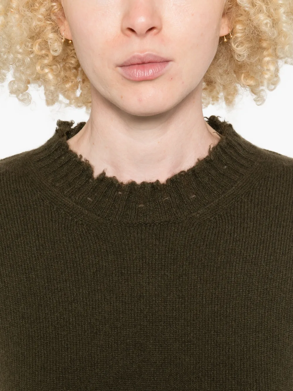 Close up of green top,showing texture of the cotton fabric.