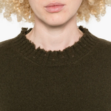 Close up of green top,showing texture of the cotton fabric.