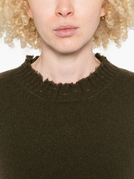 Close up of green top,showing texture of the cotton fabric.