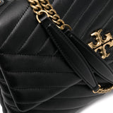Close up of black bag, showing texture of the leather fabric 