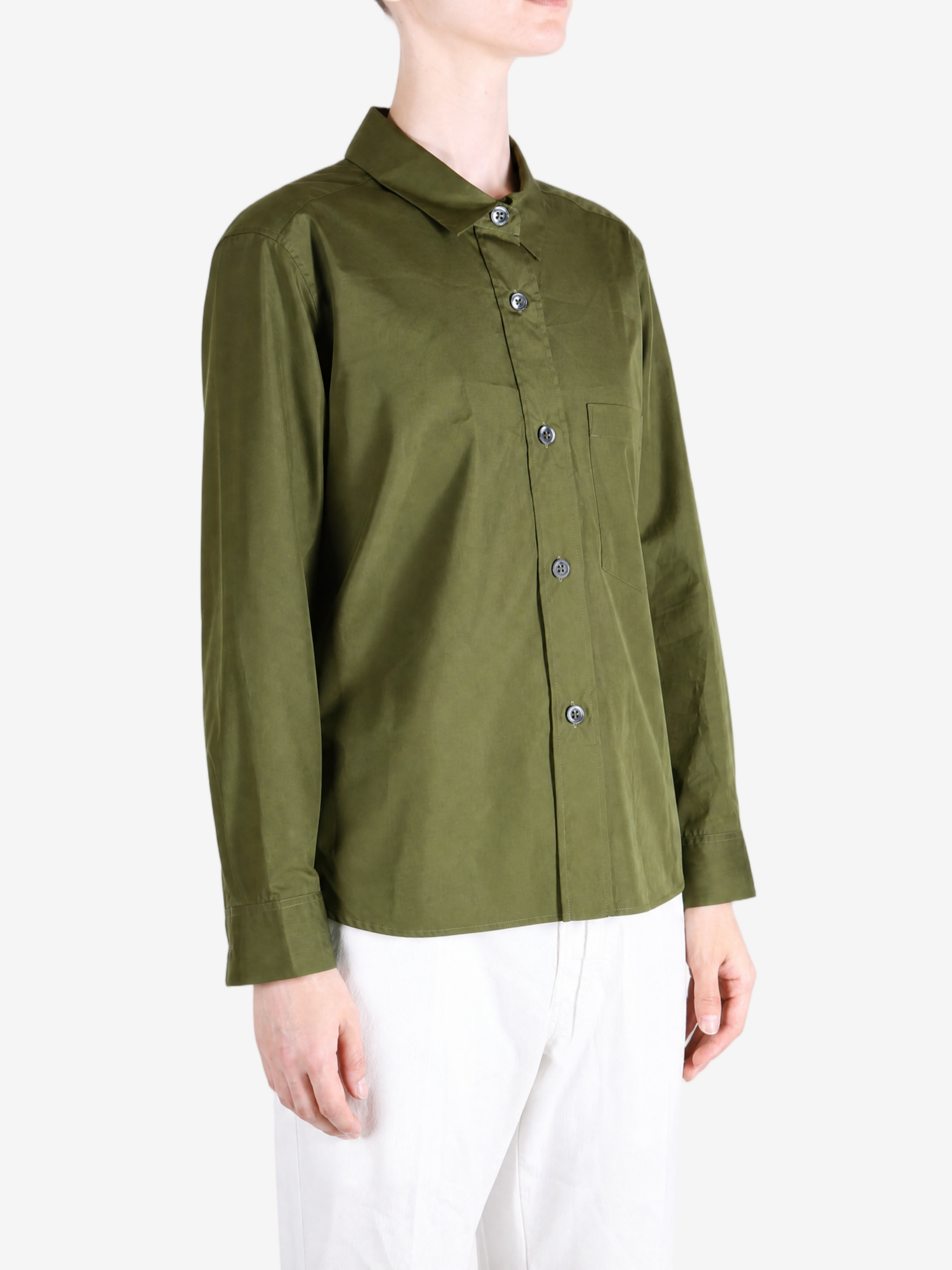 Green shirt worn by a person, showing the shirt fit