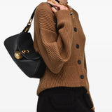 Black bag worn by a person, showing the bag fit