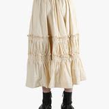 Beige tiered skirt worn by a person, showing the skirt fit