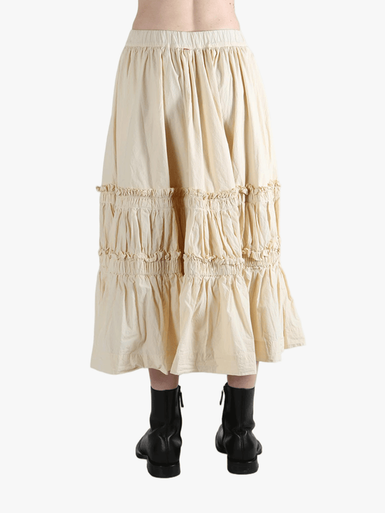 Beige tiered skirt worn by a person, showing the skirt fit