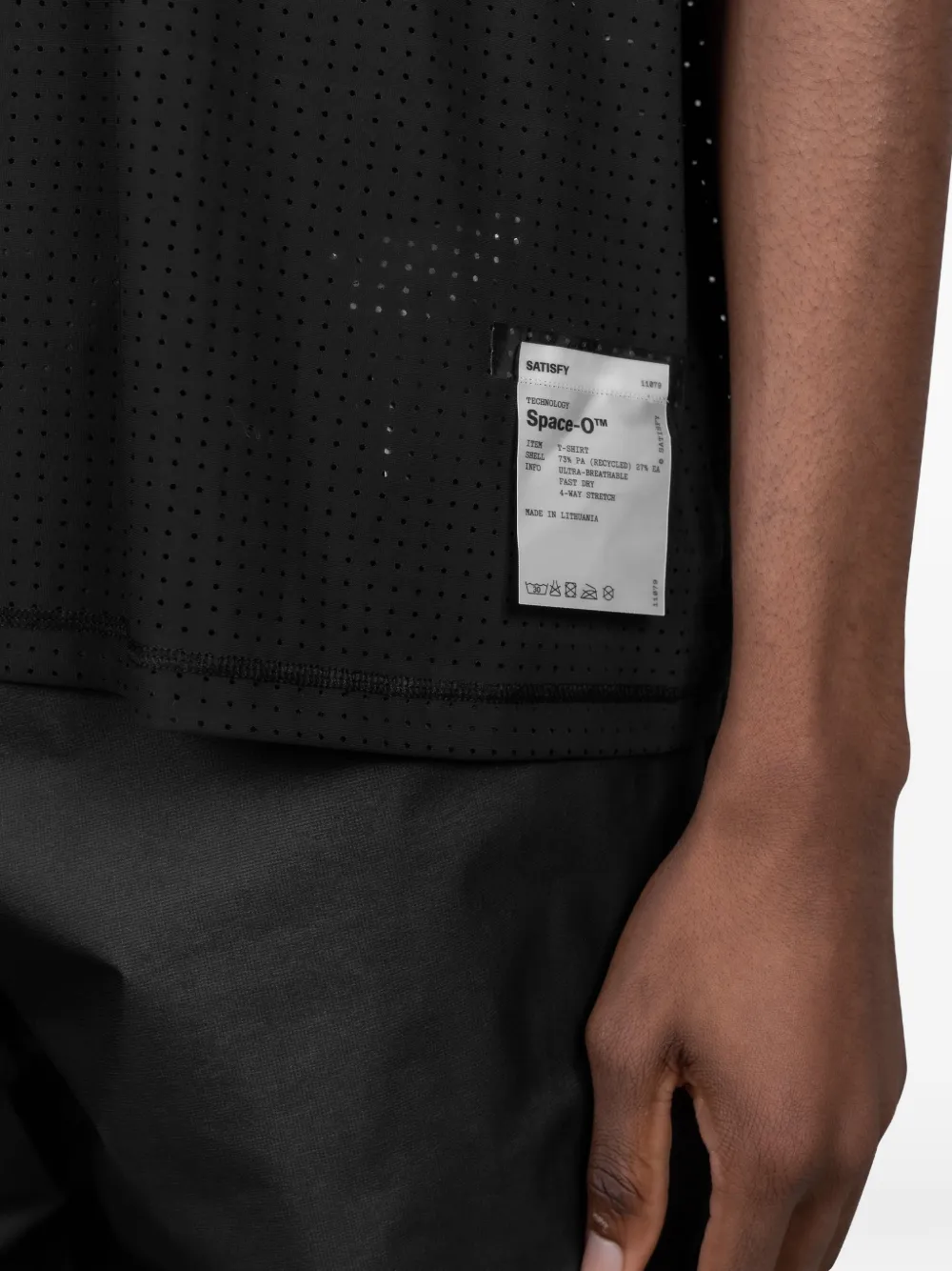 Black t-shirt worn by a person, showing the t-shirt fit