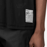 Black t-shirt worn by a person, showing the t-shirt fit