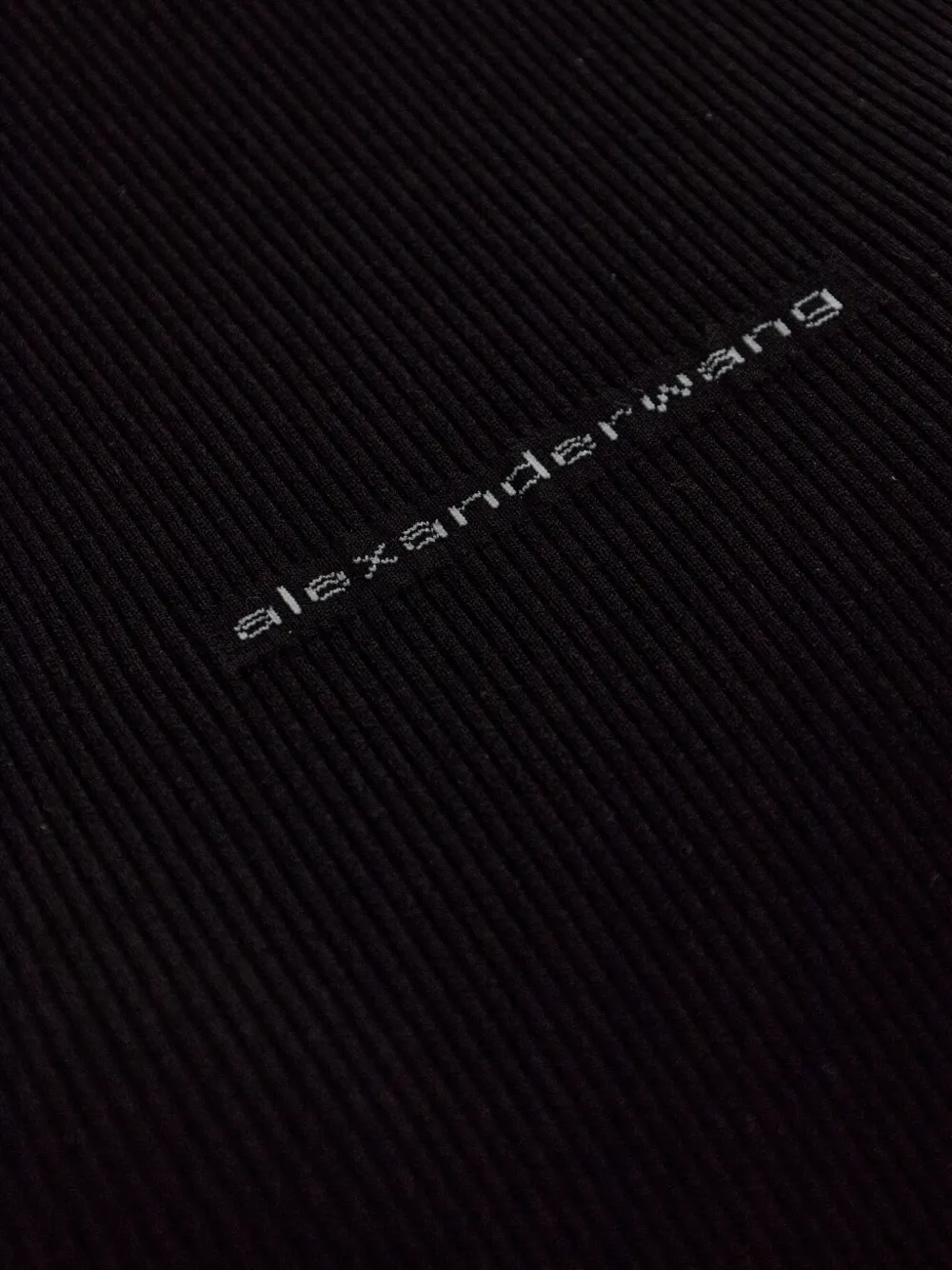 Close up of black top, showing texture of the cotton  fabric