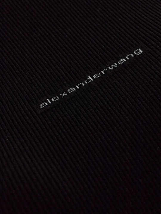 Close up of black top, showing texture of the cotton  fabric
