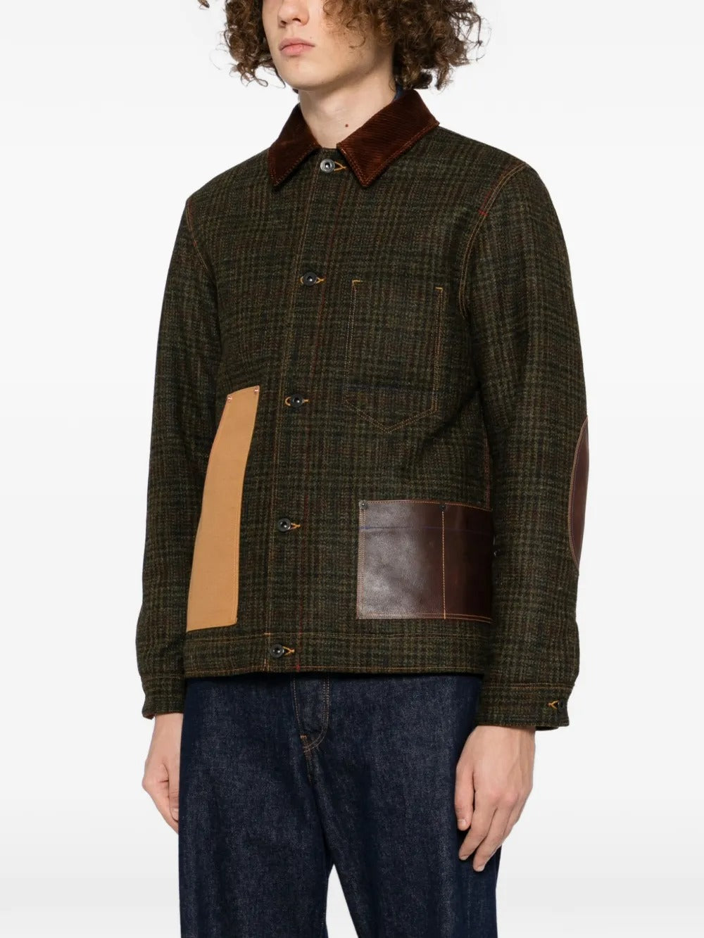 Green jacket worn by a person, showing the jacket's fit