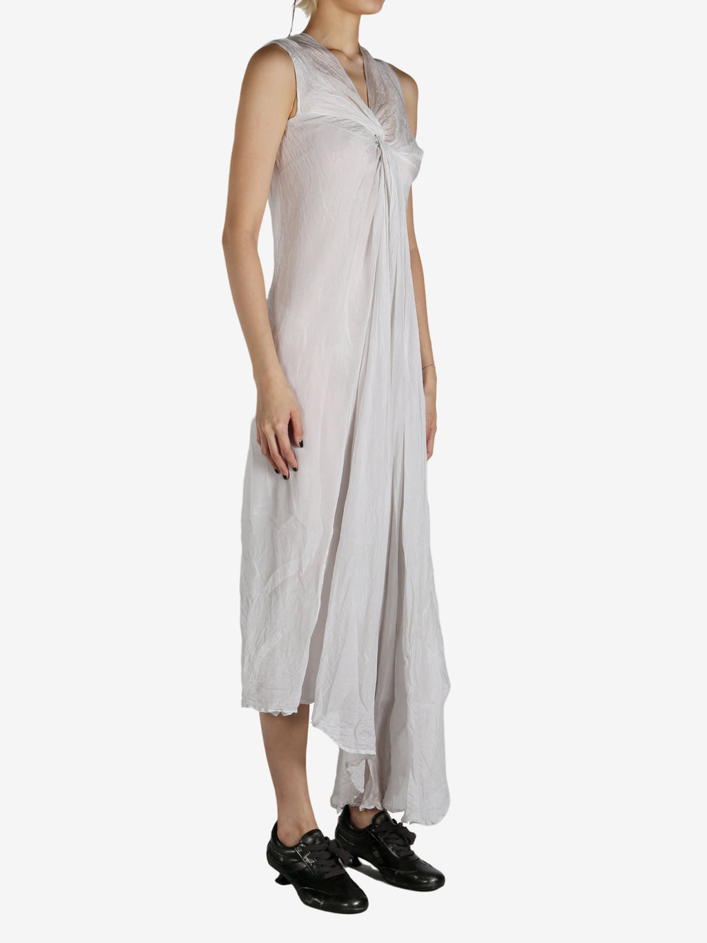 White dress worn by a person, showing the dress's fit