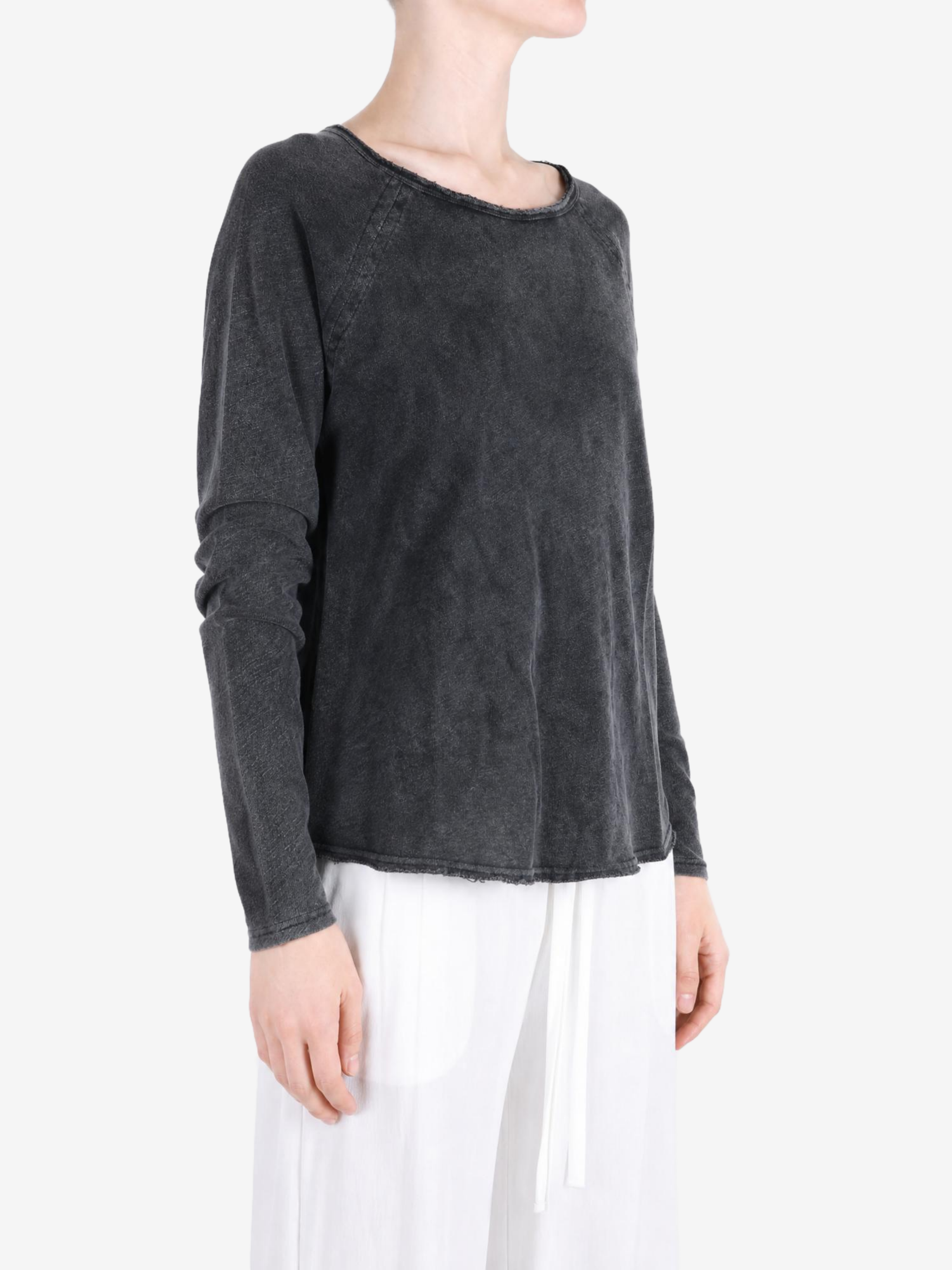 Black t-shirt worn by a person, showing the t-shirt fit
