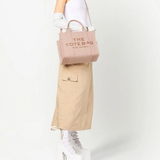 Pink bags worn by a person, showing the bags fit