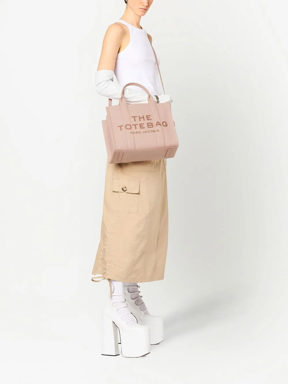 Pink bags worn by a person, showing the bags fit