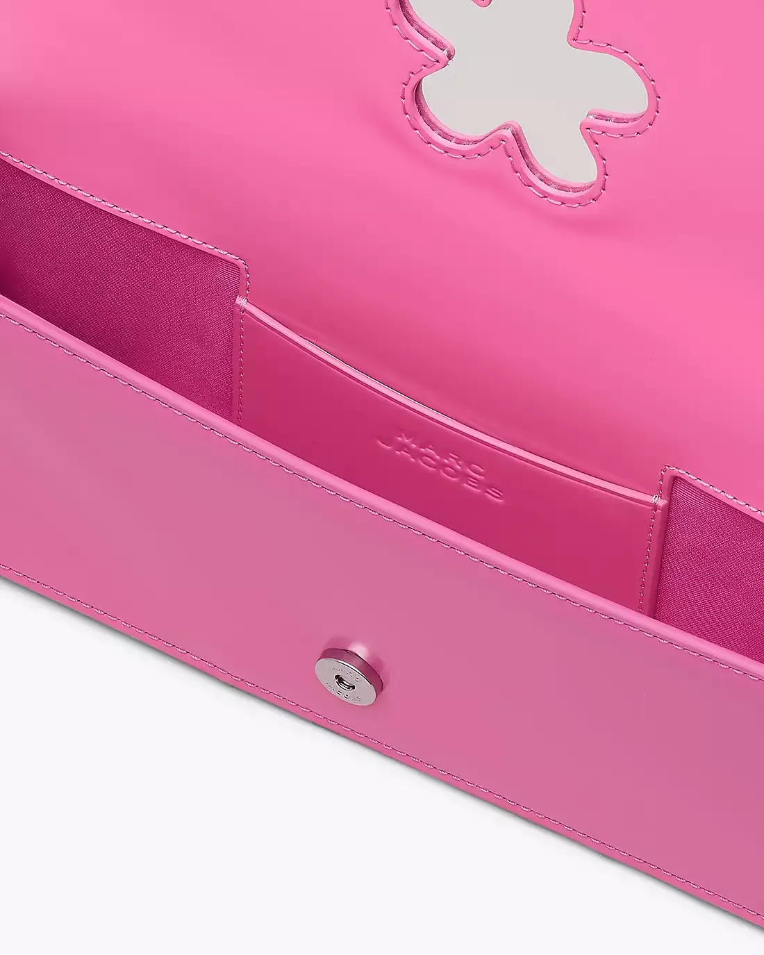 Close up of pink bag, showing texture of the leather fabric