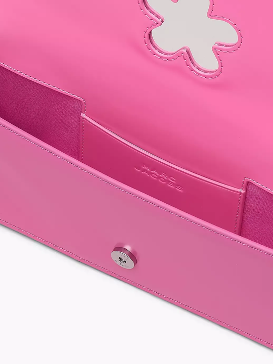 Close up of pink bag, showing texture of the leather fabric