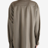 Brown shirt worn by a person, showing the shirt's fit