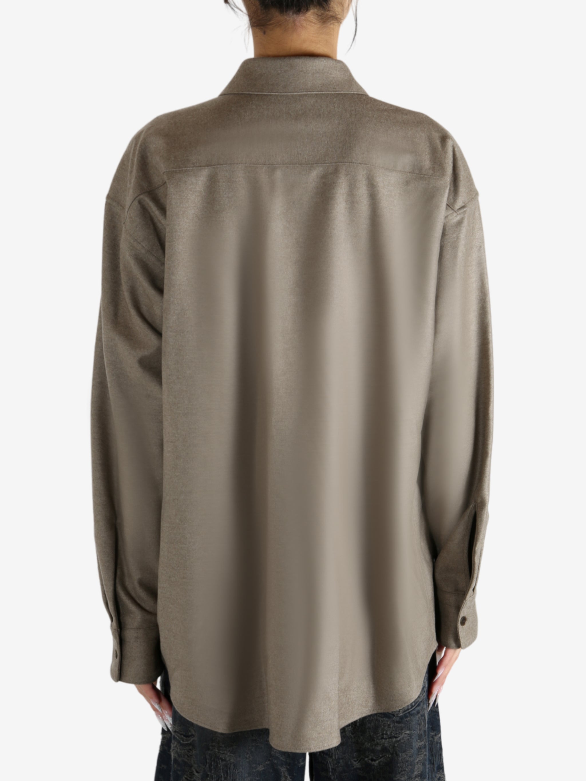 Brown shirt worn by a person, showing the shirt's fit