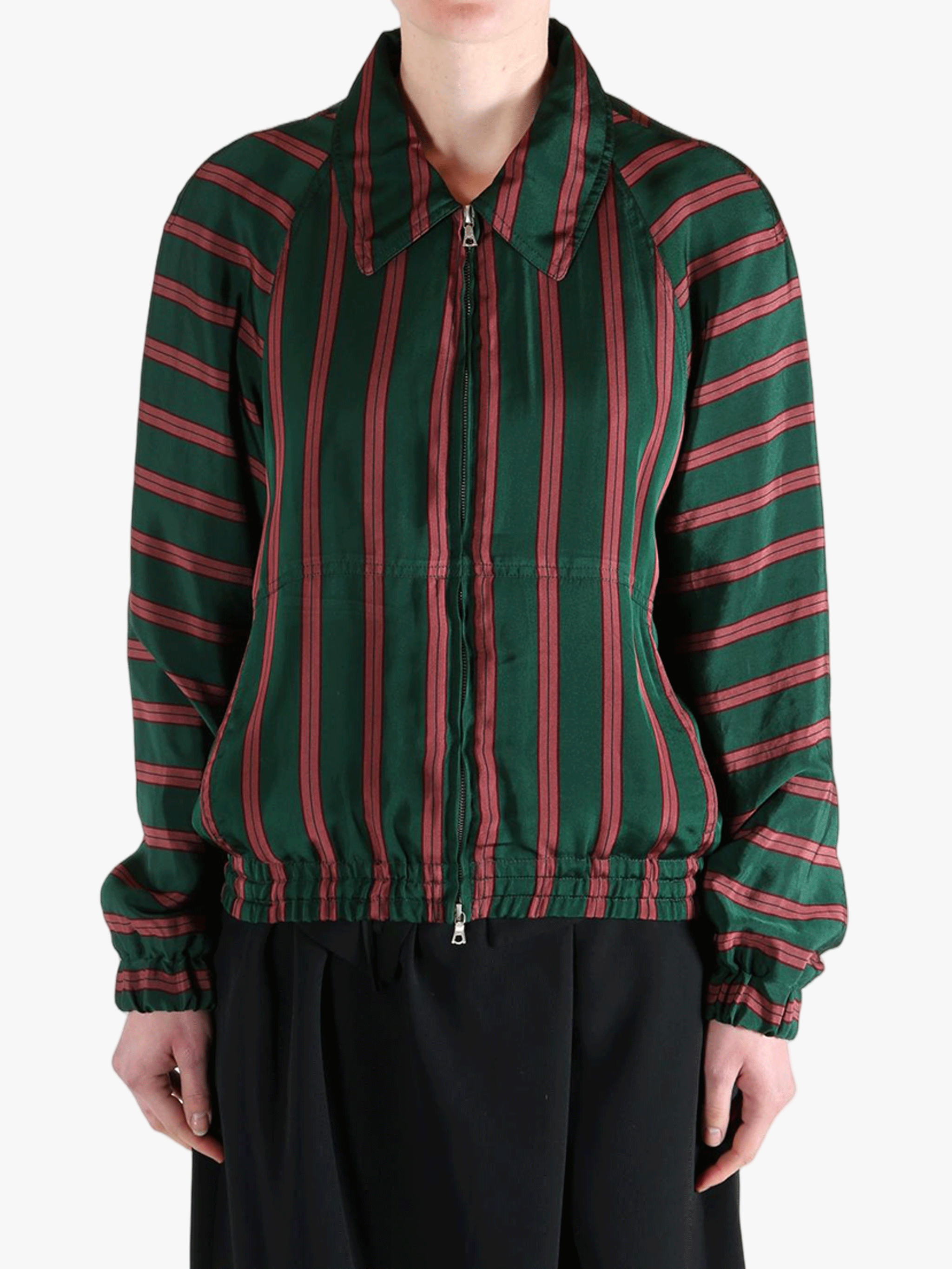 Green jacket worn by a person, showing the jacket fit