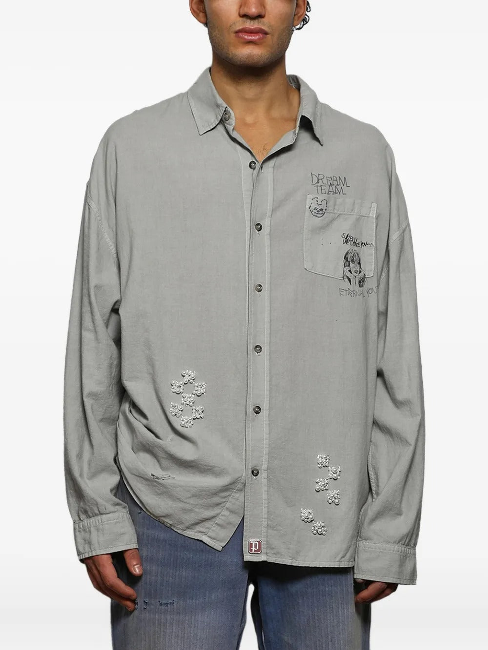 Grey shirts worn by a person, showing the shirts fit