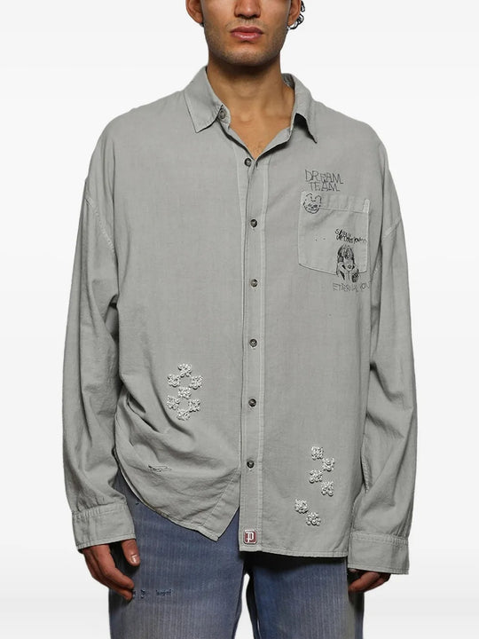 Grey shirts worn by a person, showing the shirts fit