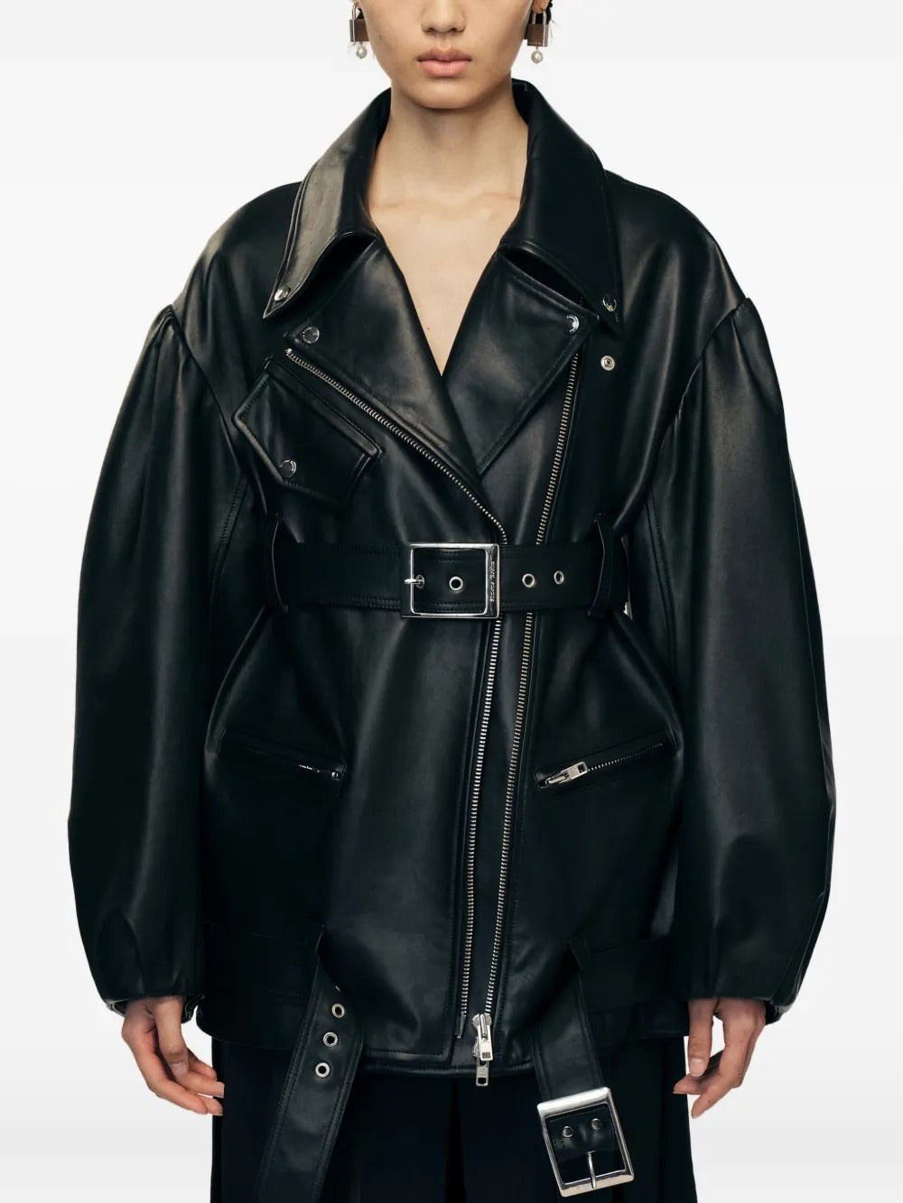 Black jacket worn by a person, showing the jacket's fit