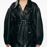 Black jacket worn by a person, showing the jacket's fit