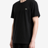 Black t-shirt worn by a person, showing the t-shirt fit