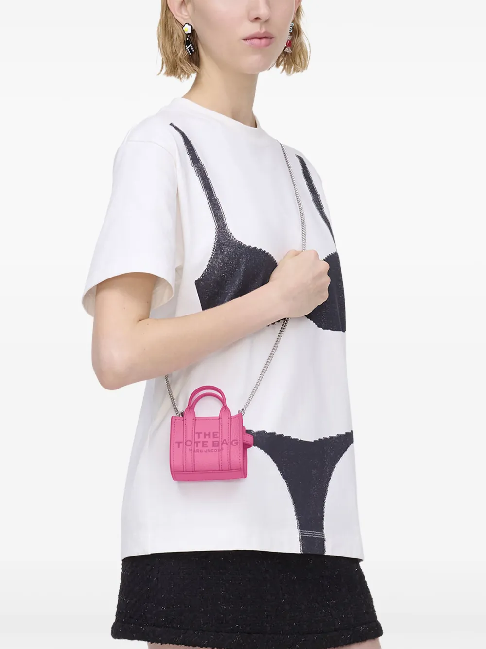 Pink bag worn by a person, showing the bag fit