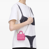 Pink bag worn by a person, showing the bag fit