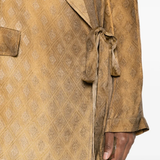 Close up of brown jacket,showing texture of the cupro fabric.