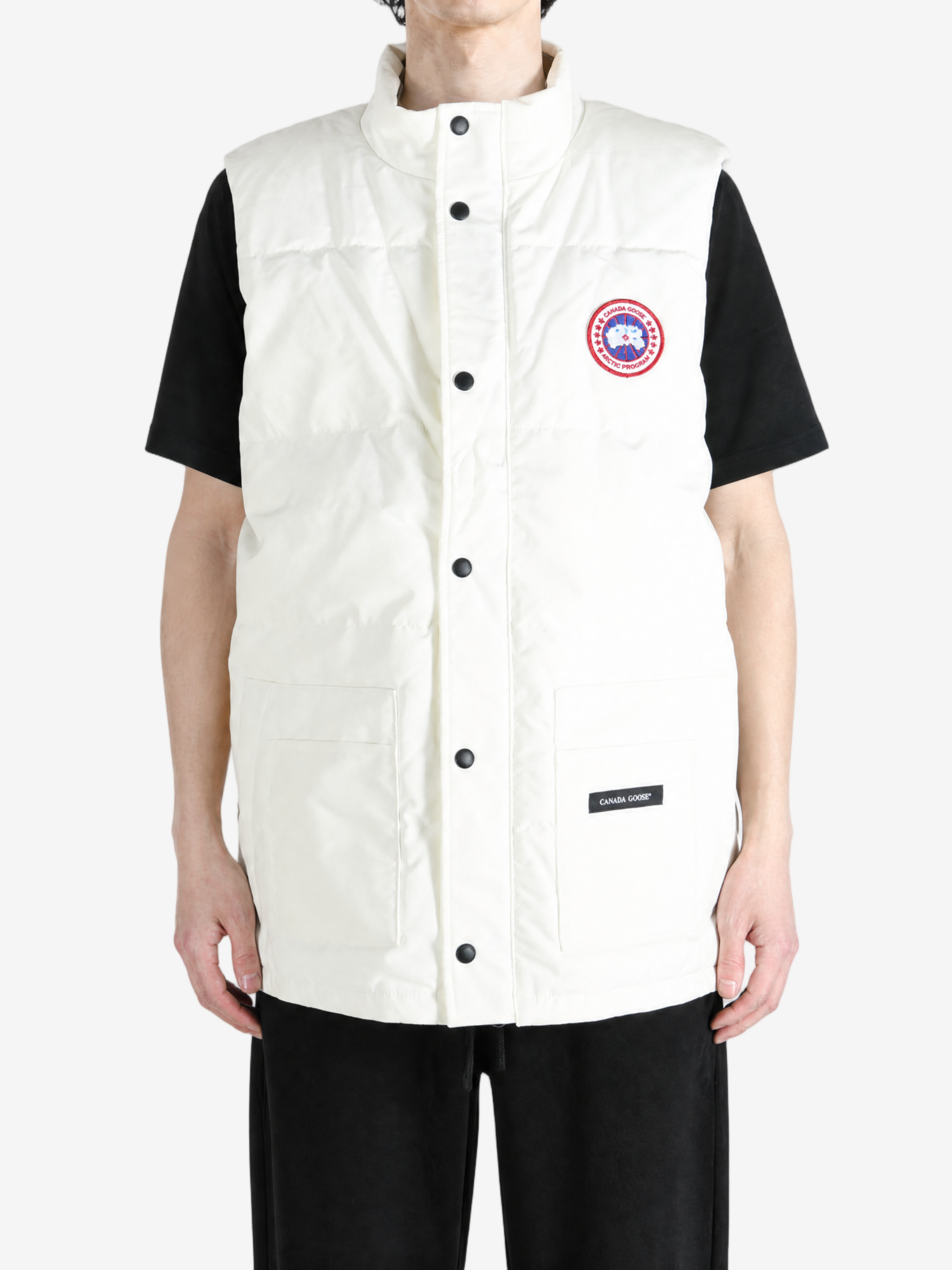 White jacket worn by a person, showing the jacket fit