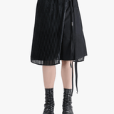 Black short worn by a person, showing the fit