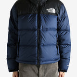 Navy jacket worn by a person, showing the jacket fit