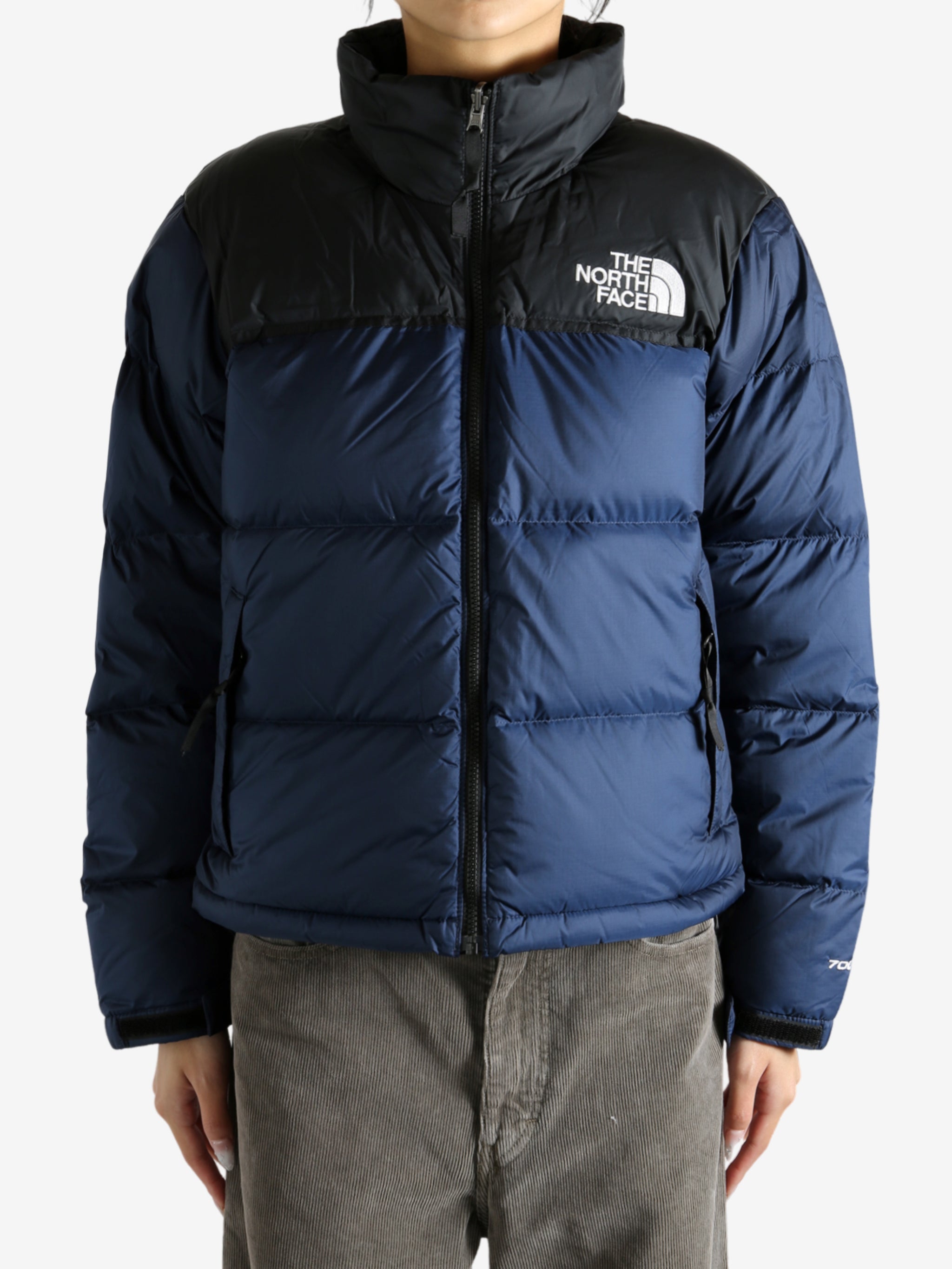 Navy jacket worn by a person, showing the jacket fit